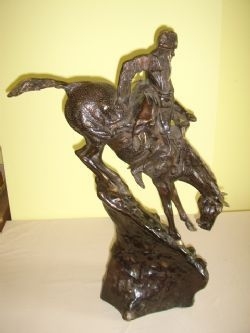 BRONZE SCULPTURE OF SIOUX WARRIER ON HORSEBACK AFTER REMINGHTON C1920