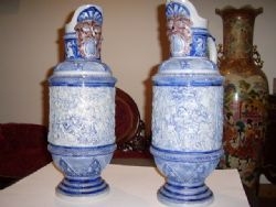 A PAIR OF CONTINENAL FACTORY EUWERS DEPICTING A BATTLE SCENE