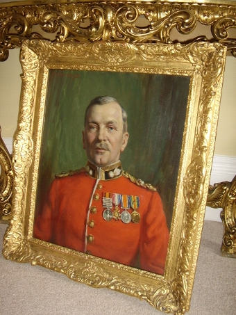 Antique MILITARY OIL PORTRAIT PAINTING OF A GRENADIER GUARD WEARING HIS RED TUNIC & MEDALS BY RESPECTED ENGLISH SCHOOL ARTIST ALFRED EGERTON COOPER BEING PRESENTED IN THE ORIGINAL DECORATIVE PLASTER GILT FRAME SIZE 31 X 27 INCHES  