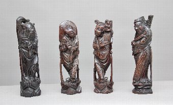 A set of four 19th Century root carvings