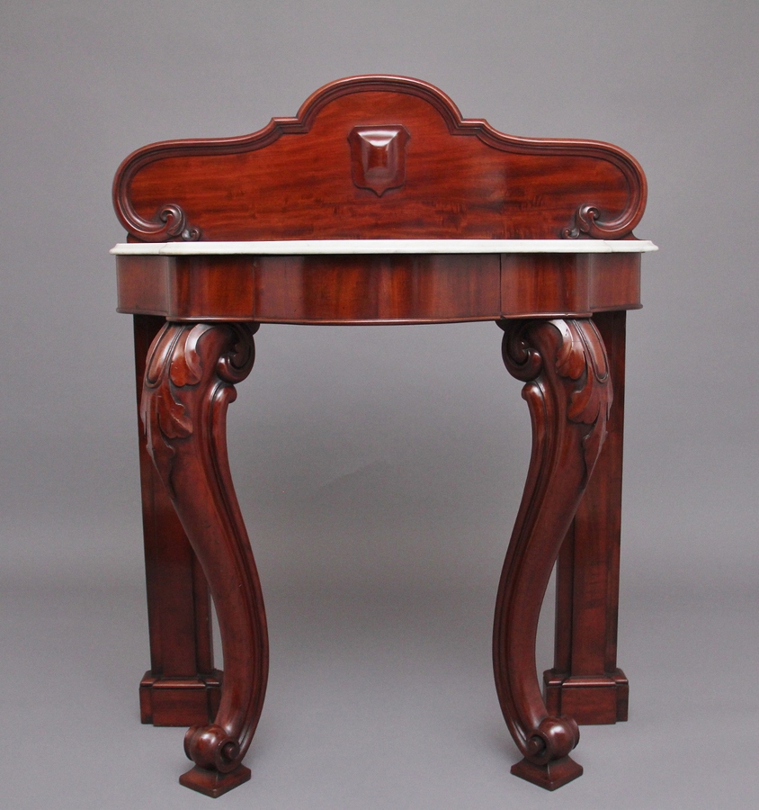 19th Century mahogany and marble top consul table