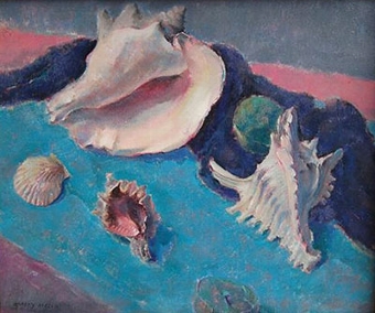 A conch and other shells on a shore