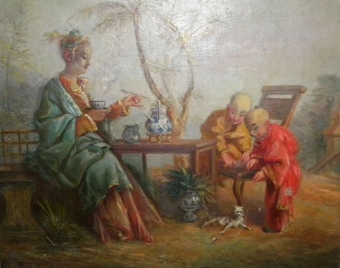 A mother taking tea, while her sons play with their kitten in an Oriental garden