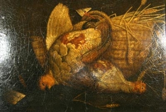 A Still life of a brace of patridge with a basket of wheat on a ledge