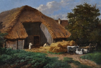Farm Labourers stacking straw stooks before a large threshing barn