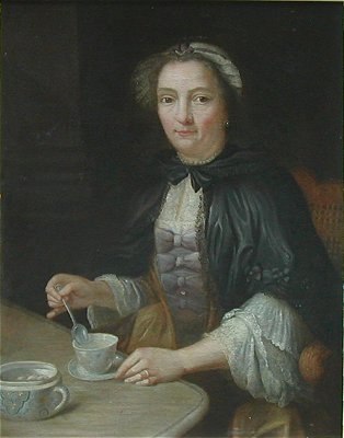 Portrait of a Lady seated at a table with a  cup of tea