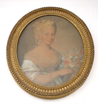Portrait of a young lady holding a bouquet of flowers