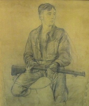 Portrait of Lt Frank Smith cleaning his rifle