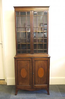 Regency mahogany bookcase on cupboard