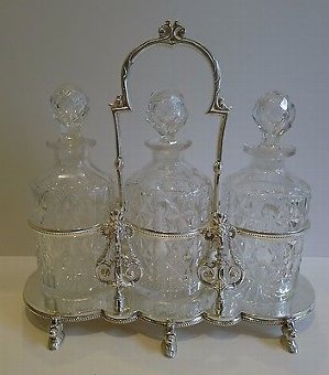 Antique English Figural Tantalus in Silver Plate With Cut Crystal Decanters