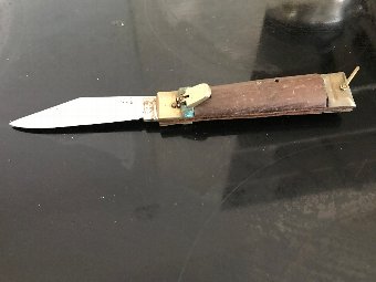 Knife with wood grips  English