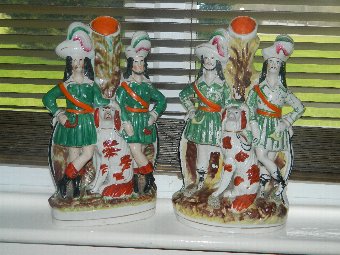 A pair of Staffordshire figures vases
