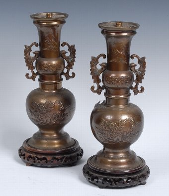 A pair of Japanese bronzed vases, now fitted as lamps