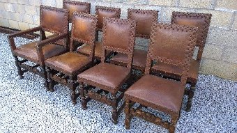 Set of 8 oak dining chairs in Jacobean Style.Very fashionable worn leather. 6 Stand chairs and two carvers
