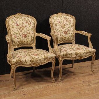Pair of Italian lacquered and gilded armchairs with floral fabric
