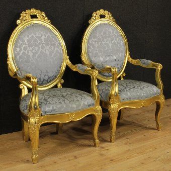 Pair of Italian gilded armchairs with floral fabric
