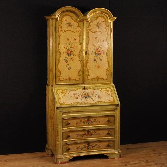 Venetian lacquered, golden and painted trumeau with floral decorations