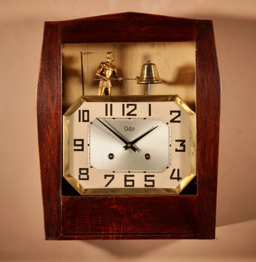 A French Art Deco Oak Signed Odo Automation Striking Wall Clock.