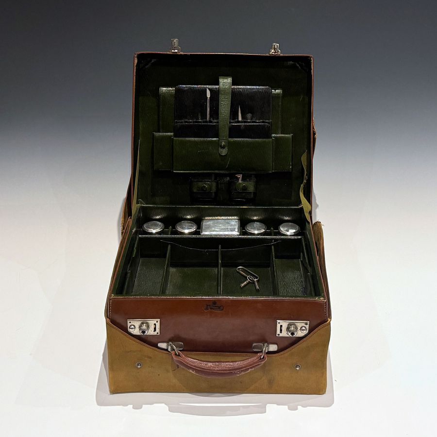 #101673 J C Vickery Regent St. An Early 20th Century Cowhide Travel Dressing Case.
