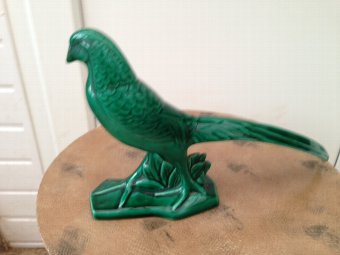 A perfect example of a art-deco period figure of a game bird possibly a pheasant 23cm by 33cm by 6cm