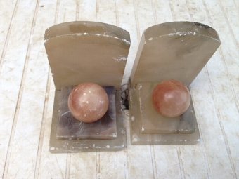 Antique  Art-deco greyish coloured marble book ends with salmon pink coloured orbs 