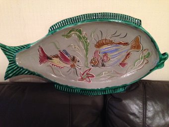French mid-20th century fish plate 61cm by 31cm flamboyantly decorated in a multitude of colours and two images of fish