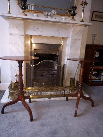 A pair of Regency mahogany oval tripod tables, c. 1820