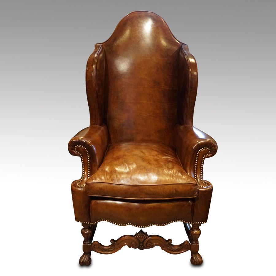 Antique walnut leather wingback chair