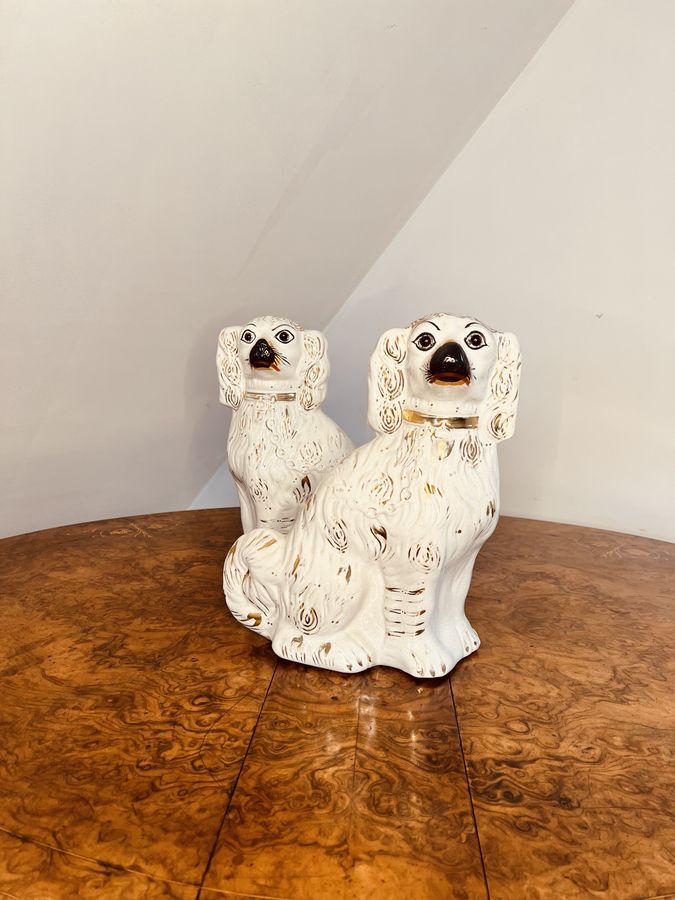 Antique Charming pair of antique Victorian Staffordshire seated spaniels 