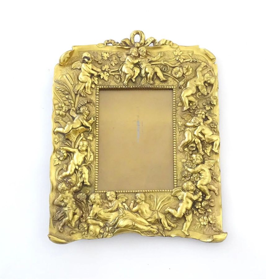 Antique Non-trivial photo frame of gilded bronze in the Neo-Baroque style, the turn of the 19th-20th centuries.