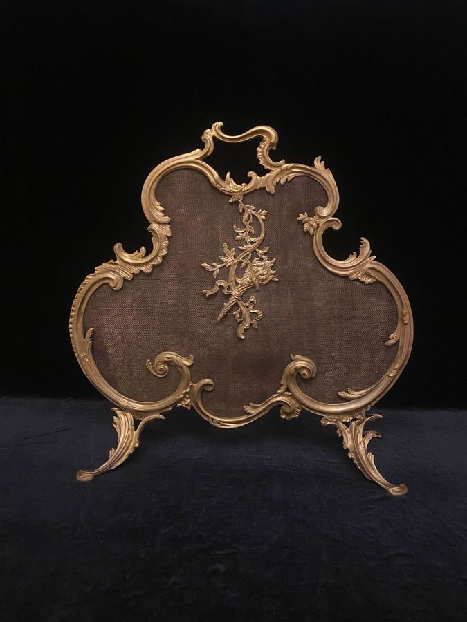 Antique bronze mantel screen from the 19th century.