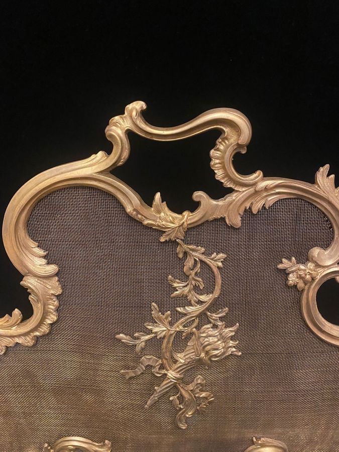 Antique Antique bronze mantel screen from the 19th century.