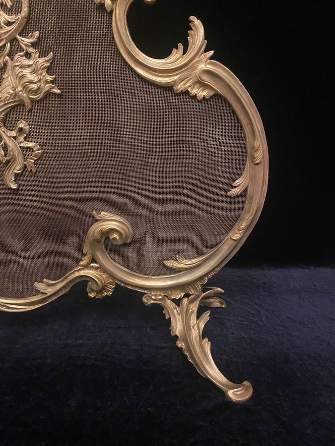 Antique Antique bronze mantel screen from the 19th century.