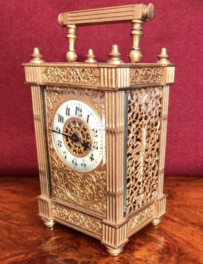 Carriage Clock With Filigree Mask And Side Panels Circa 1900