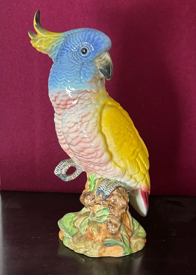 Antique Por el figure of a cockatoo 