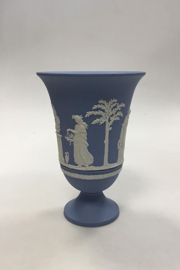 Antique Wedgewood Blue vase on foot with decorated with sacrificial vessel and Cupid. Measures 19 cm (7 31/64 in.)