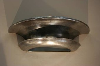A pair of 1930s polished steel wall lights