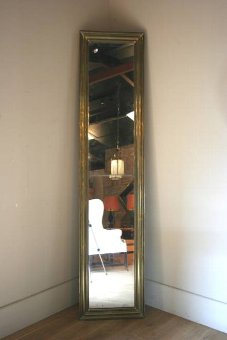 A C19th brass bistro mirror of highly unusual proportion