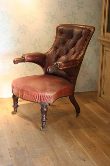 A C19th English library chair in original leather
