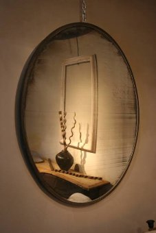 A huge and fantastic early C20th convex mirror
