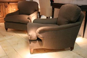 A pair of late C19th English Howard style armchairs