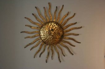 A pair of sunburst wall appliques