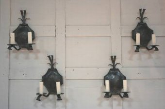 A set of 4 iron wall lights by Herbert Trapp