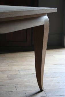 A stylish 1950s French oak dining table