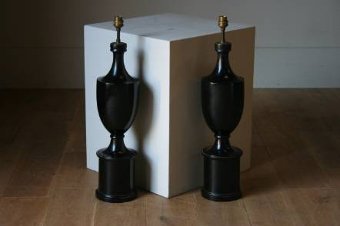 A very stylish pair of ebonised lamps