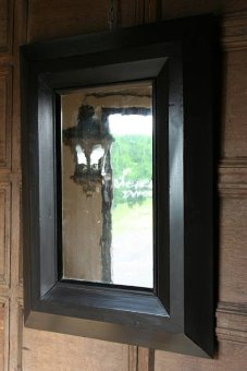 An unusual C19th ebonised mirror