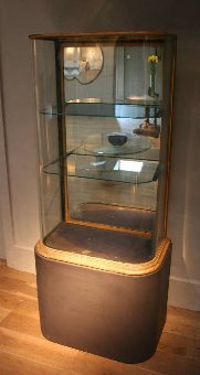 A C19th English curved glass shop display cabinet