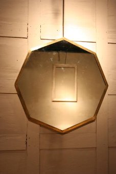 A 1950s60s octagonal brass mirror