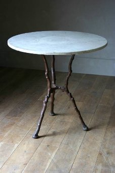 A C19th cast iron twig table with marble top