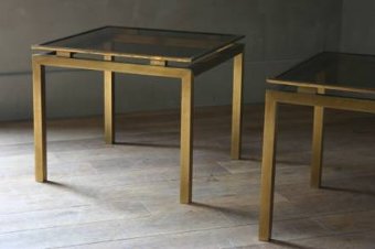 A pair of 1960s brass side tables